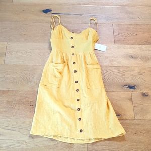 BNWT m.n.i los angeles yellow cut out back dress size small. Brand new